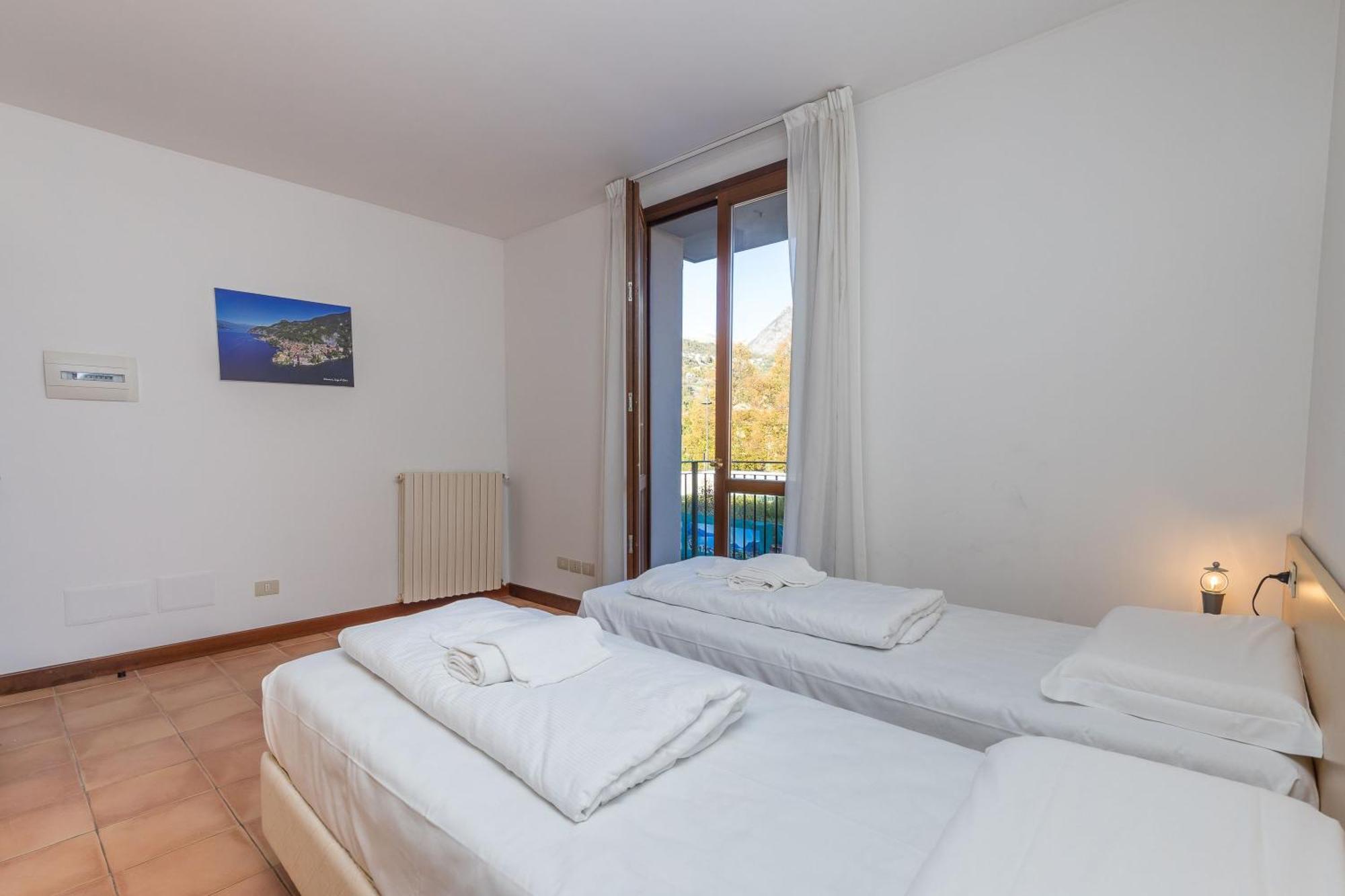 Budget Village Apartments - Porto Letizia Porlezza Exterior foto